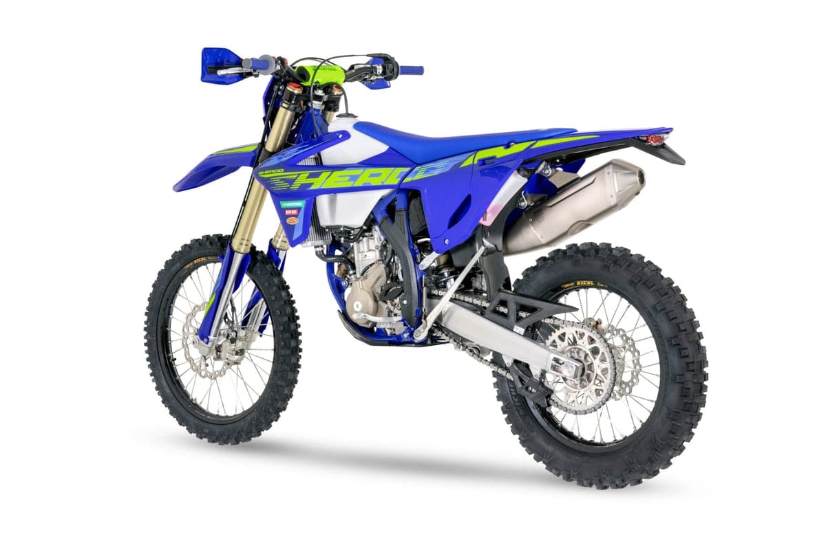 Sherco 300 SEF Factory rear three-quarter studio shot showing the tail section, chain guide and stubby Akrapovic exhaust can