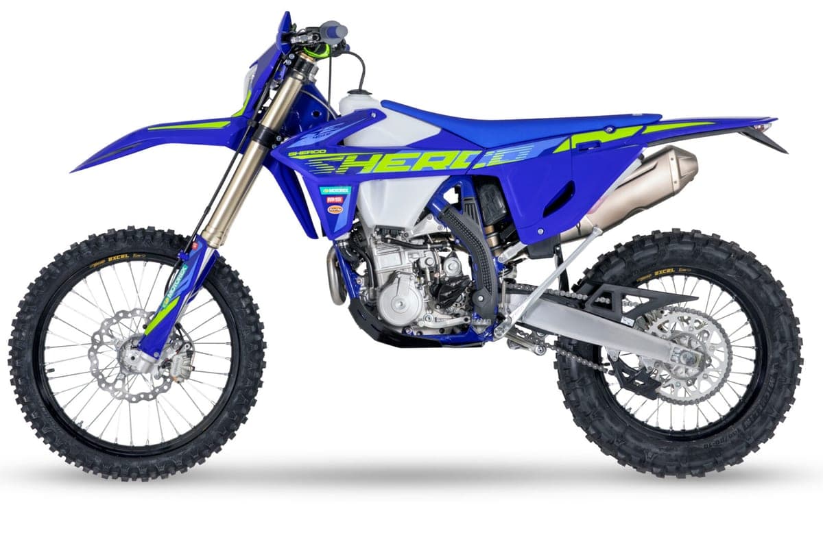Sherco 450 SEF Factory, right-side studio profile highlighting the white radiator shrouds, muffler and spoked wheels with knobby tires