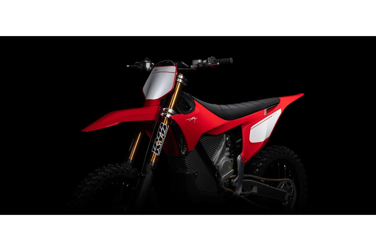 Stark Varg MX Factory Edition front three-quarter view showing the titanium footpegs, grip seat and Dunlop MX34 tires