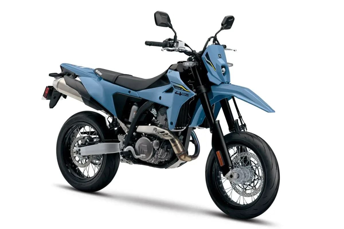 Suzuki DR-Z4SM in matte blue, front three-quarter studio view highlighting the LED headlight, radiator shrouds and inverted forks
