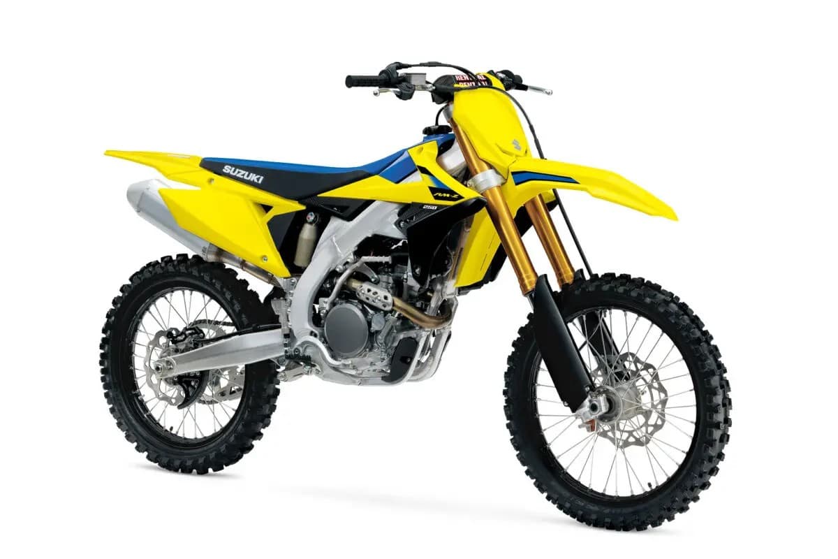 2027 Suzuki RM-Z250 in yellow and blue, front three-quarter studio view showing the Renthal handlebars, front disc brake and inverted forks
