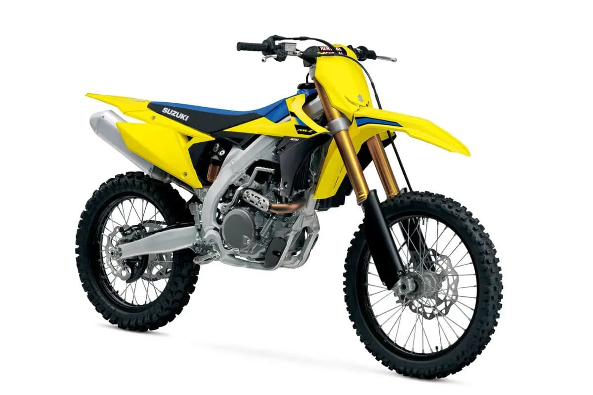 Suzuki RM-Z450 front three-quarter studio view highlighting the gold coil fork, number plate graphics and black seat with blue accents