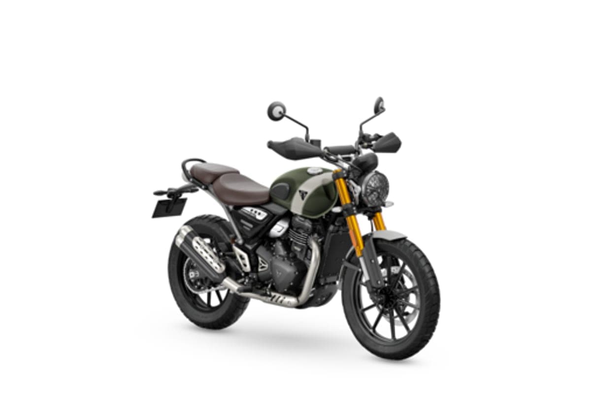 Triumph Scrambler 400 X in olive green, front three-quarter studio view highlighting the round headlight, gold forks and spoked wheels