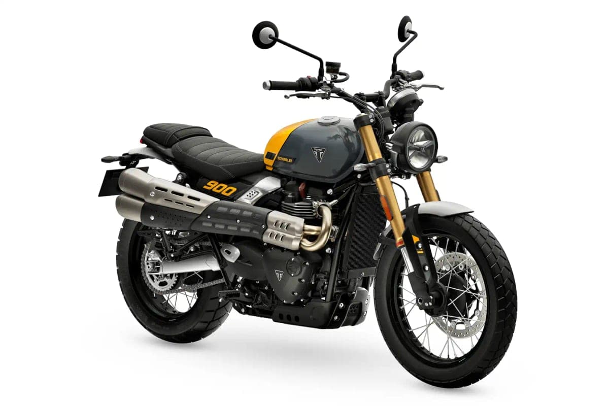 Triumph Scrambler 900 in grey and yellow, rear three-quarter studio angle showing the twin megaphone silencers and knobby-style tires