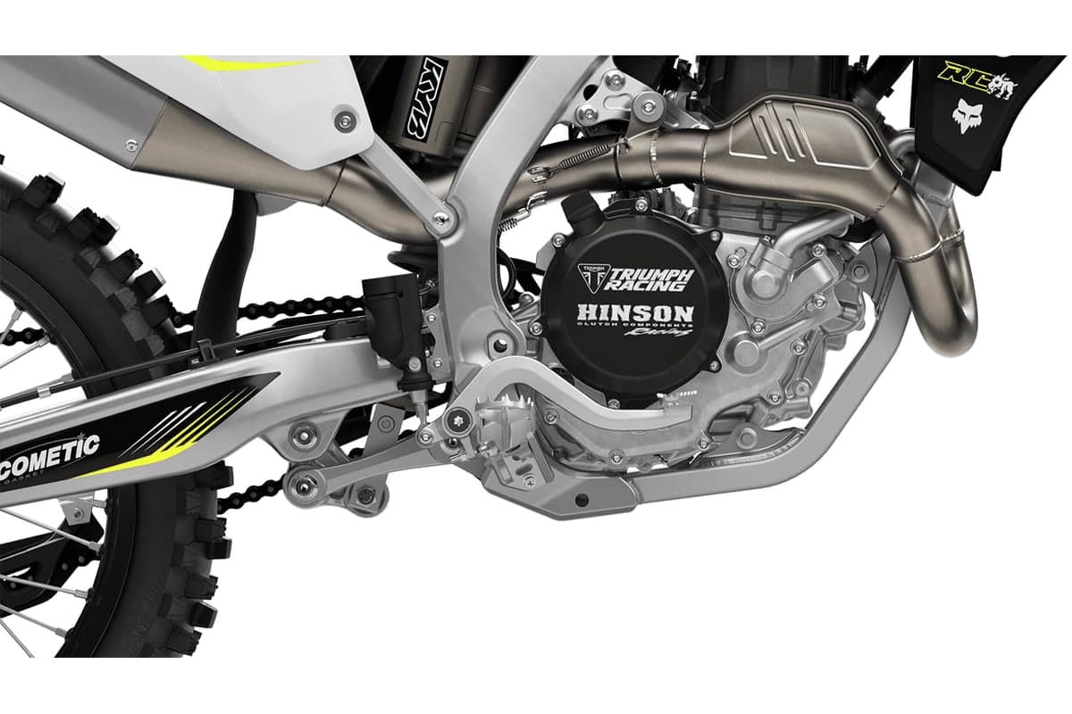 Detail of the Triumph TF 450-RC's Hinson clutch cover and exhaust header on the right side of the engine