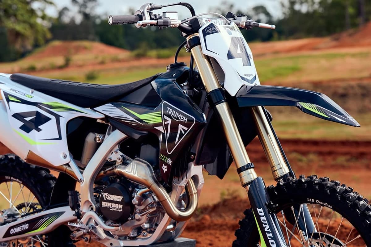 Front three-quarter detail of the Triumph TF 450-RC showing the number 4 board, ODI RC4 bars and KYB fork