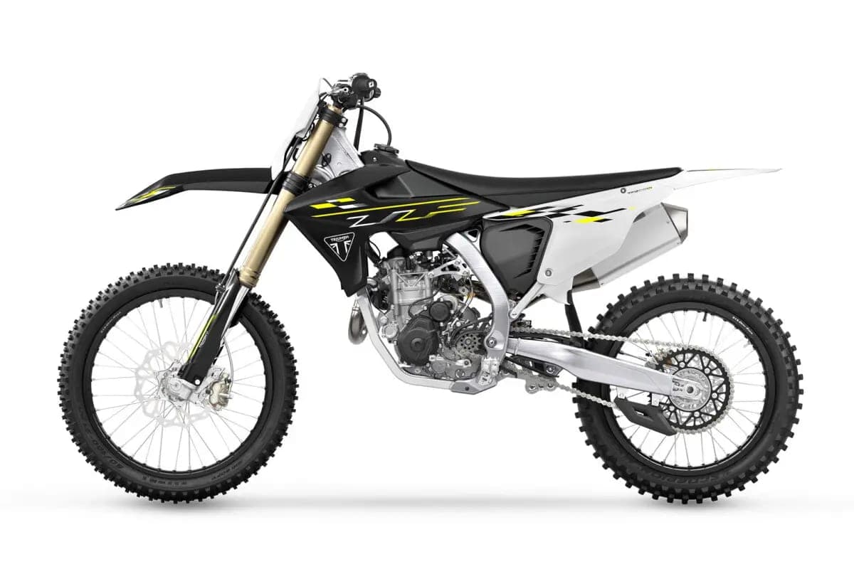 Triumph TF 450-X left-side studio profile showing the aluminum perimeter frame, gold fork tubes and black rear disc guard