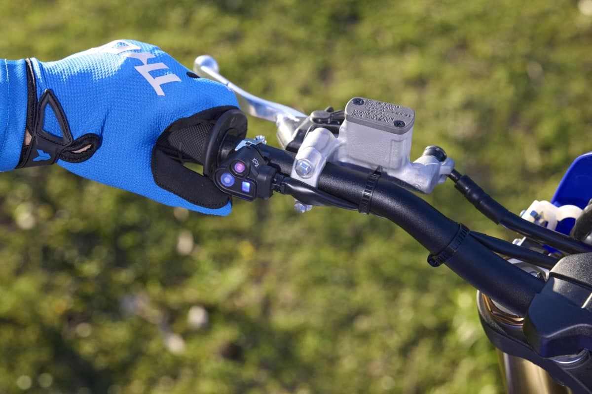Left handlebar of the 2027 WR450F, showing the master cylinder of the new hydraulic clutch beside the handlebar mode switch