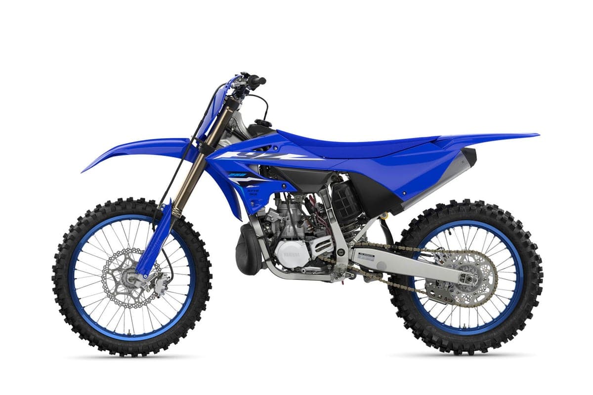 Yamaha YZ250 left-side studio profile highlighting the aluminum frame, exposed two-stroke engine, chain guard and gold coil-spring fork