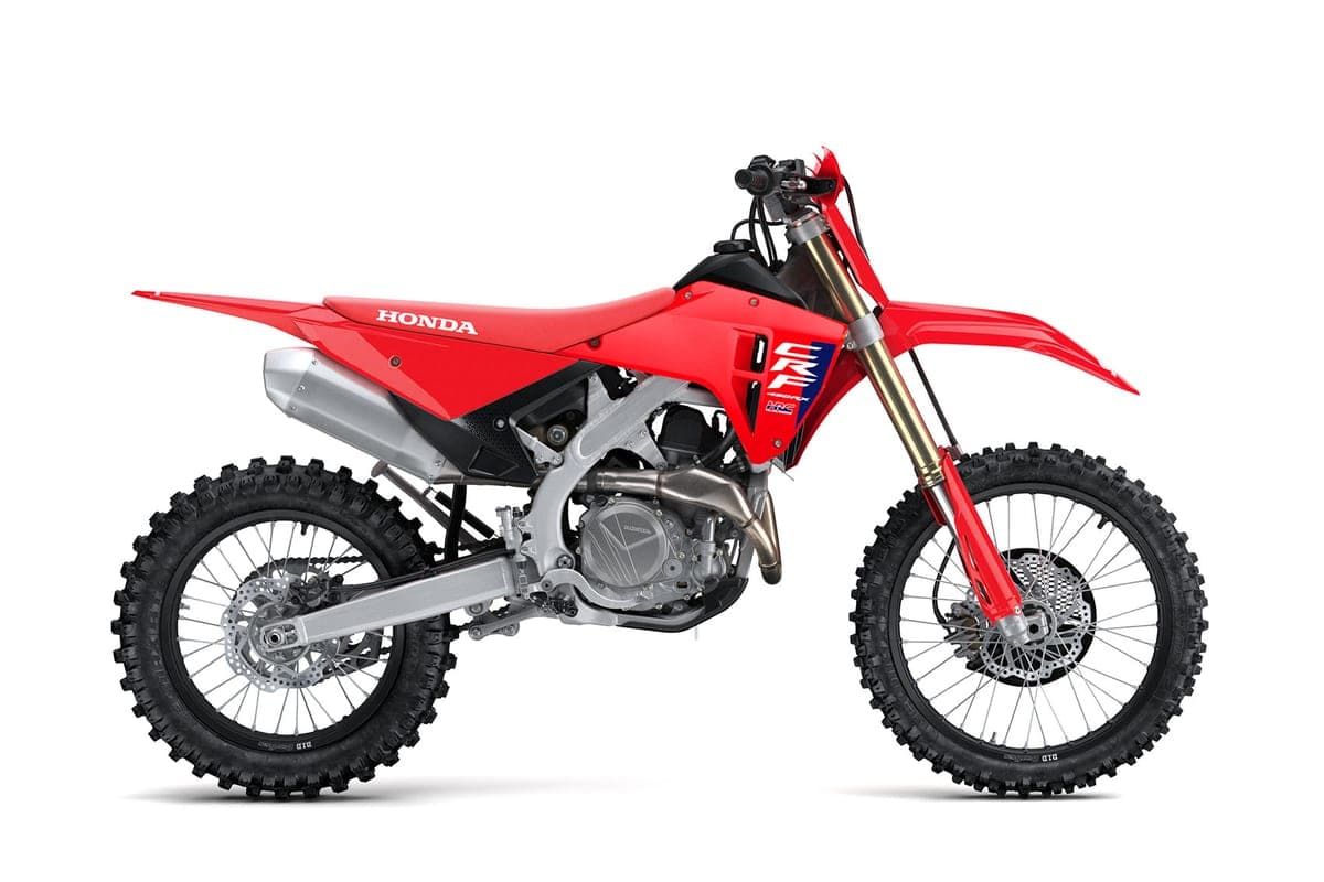 2027 Honda CRF450RX cross-country bike in red, right-side studio profile showing gold-coated forks, silver exhaust and knobby tires