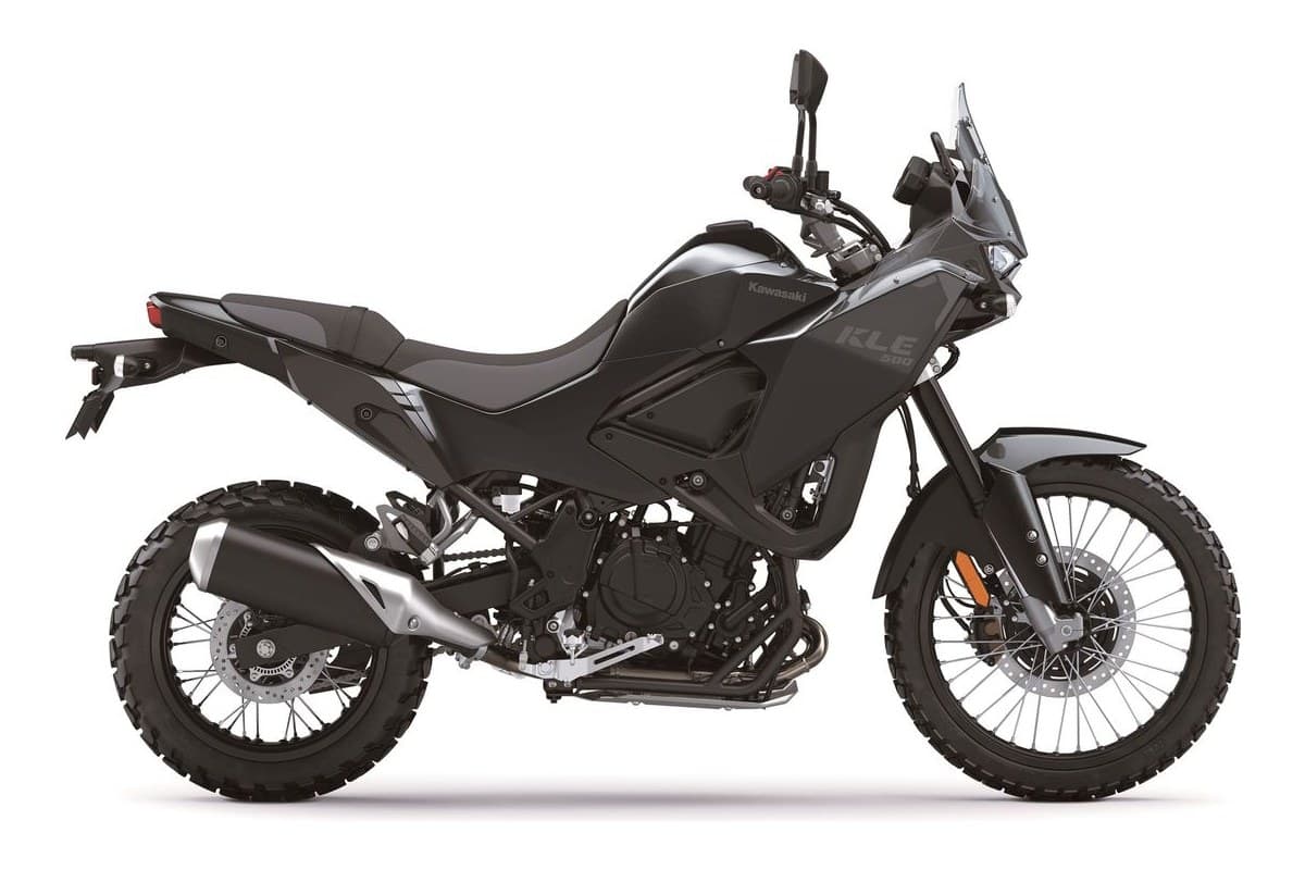 2026 Kawasaki KLE500 ABS adventure bike in white with green trellis frame, right-side studio profile showing spoked wheels and tall windscreen