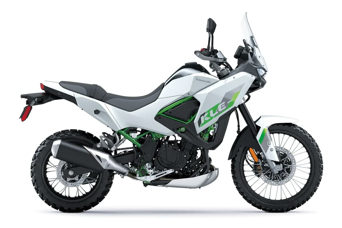 2026 Kawasaki KLE500 SE ABS in Pearl Blizzard White with green graphics and frame, side studio profile showing the tall windscreen and spoked wheels