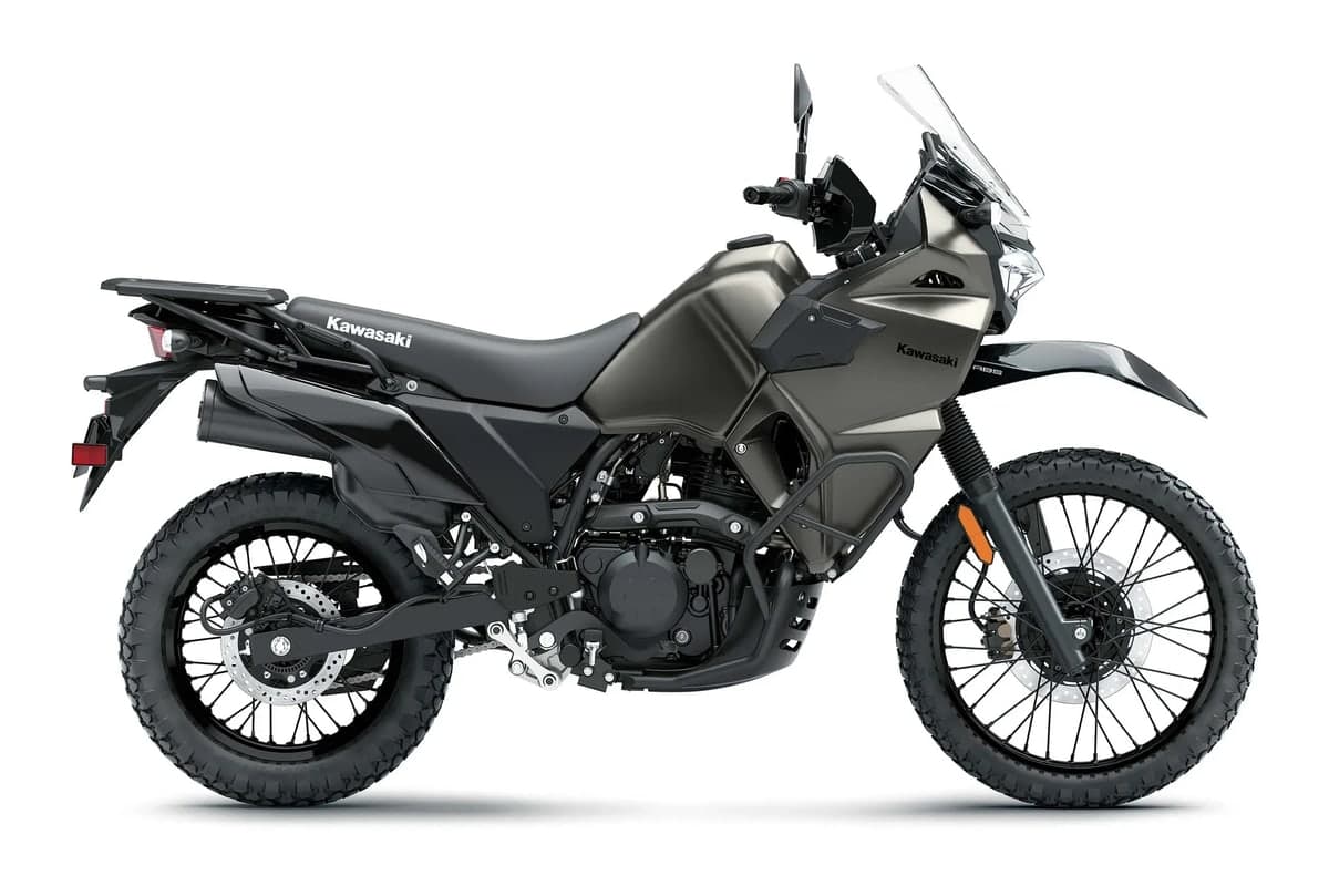 2027 Kawasaki KLR650 DF ABS in Metallic Flat Raw Graystone, side studio profile showing the blacked-out parts and frame sliders