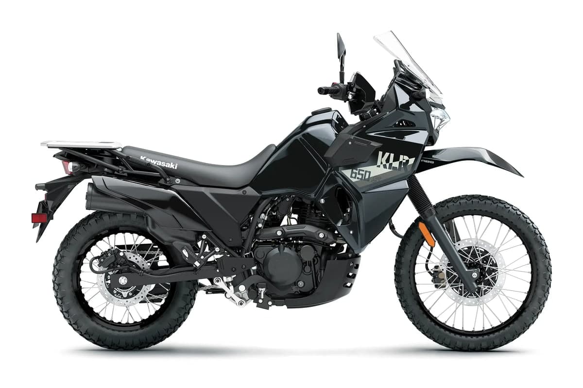 2027 Kawasaki KLR650 S in Metallic Spark Black, side studio profile showing the windscreen, rear rack and spoked wheels