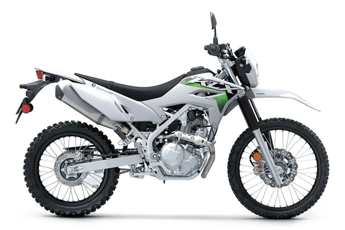 2027 Kawasaki KLX230 S ABS dual-sport in white and green, right-side studio profile showing the front disc brake and knobby dual-sport tires