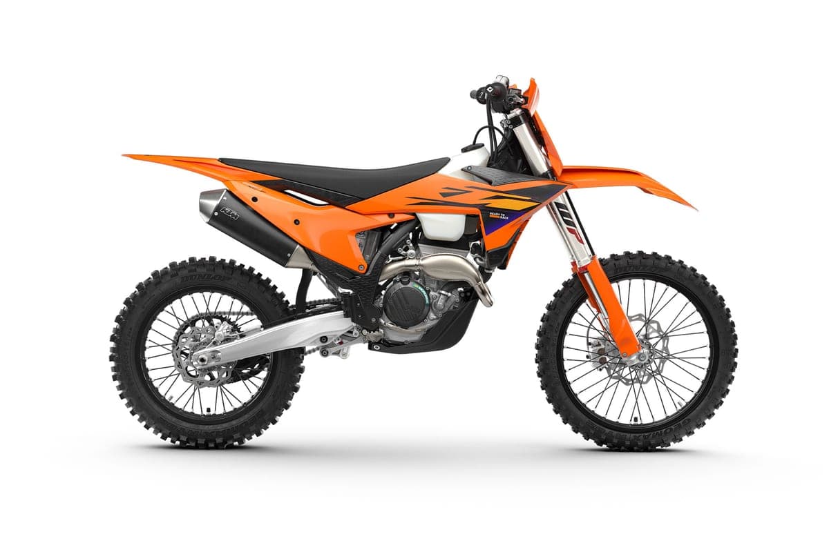 2027 KTM 250 XC-F cross-country bike in orange and black, right-side studio profile showing the WP fork, FMF-style silencer and Dunlop knobby tires