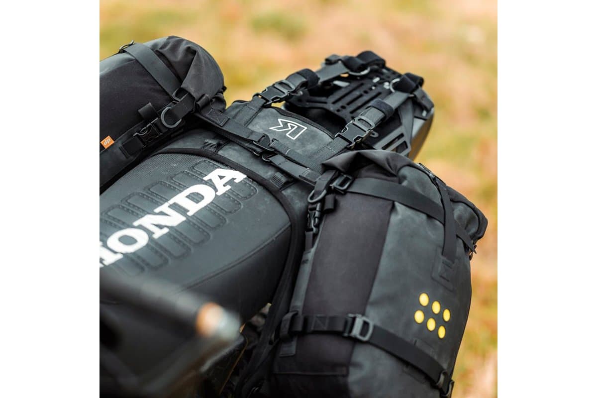 Close-up of the OS-Base harness and packs strapped over a Honda seat