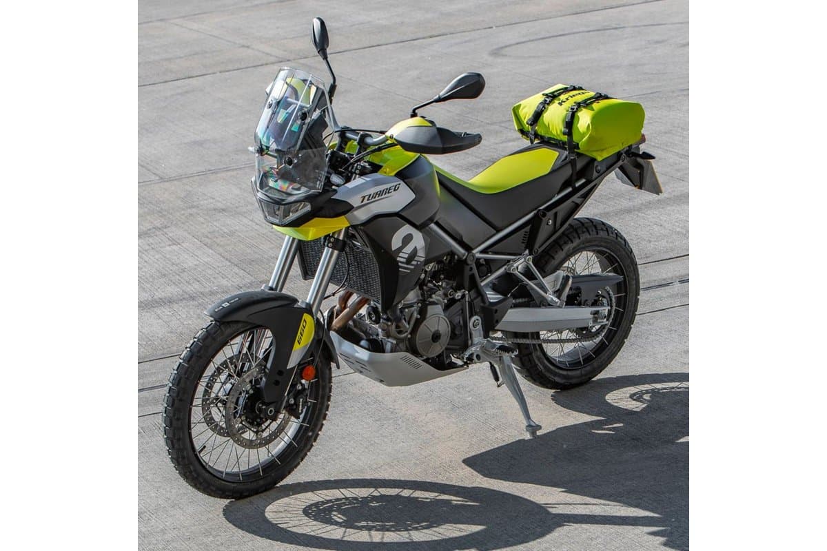 Rollpack 20 in lime on the tail of an adventure bike