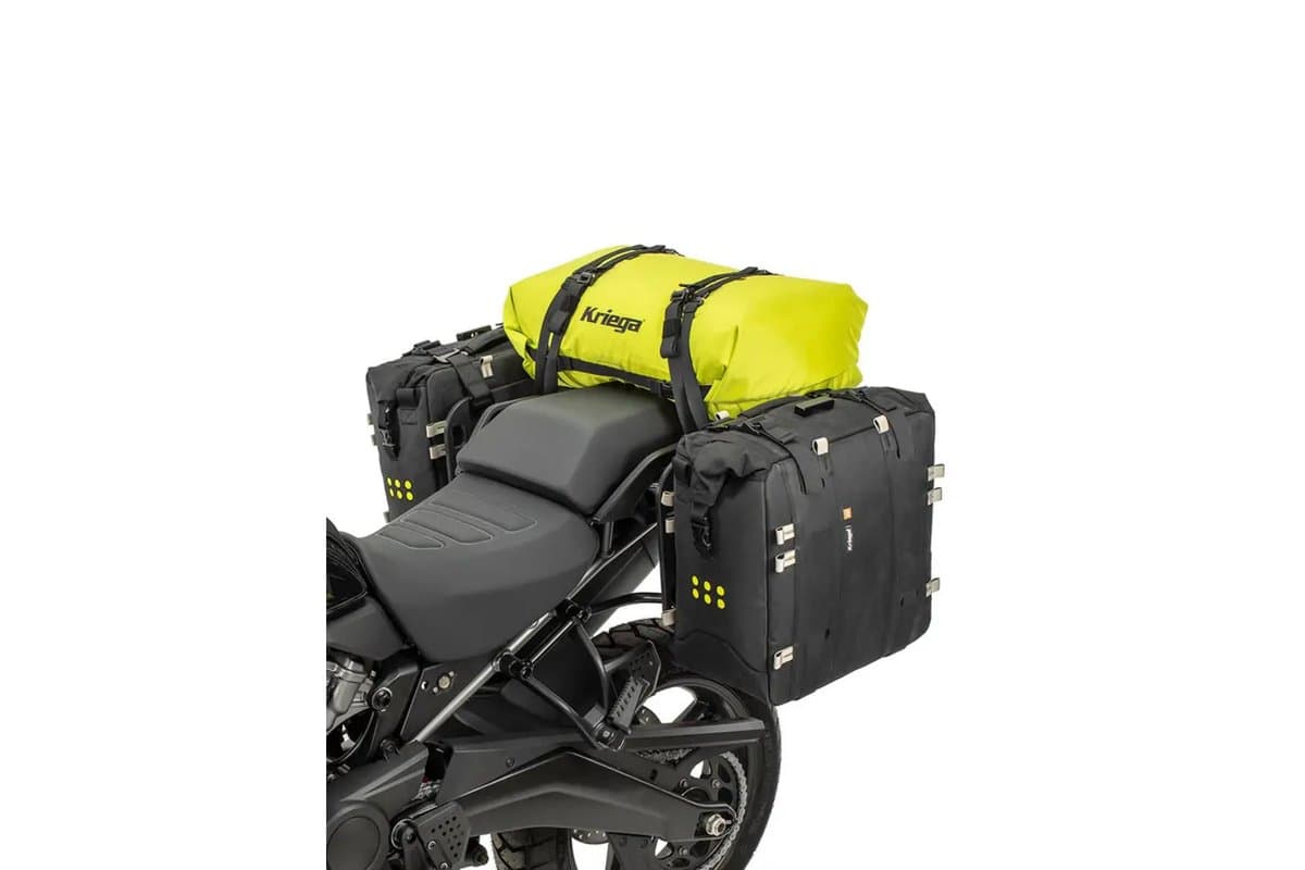 Rollpack 40 in lime on a bike seat between soft panniers