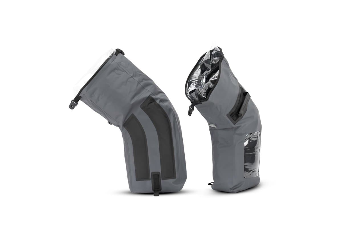 The two 25 L side dry bags out of their holsters, one open
