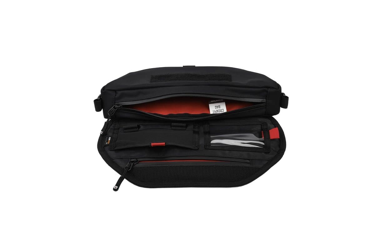 Handlebar bag open showing the pockets and card holder