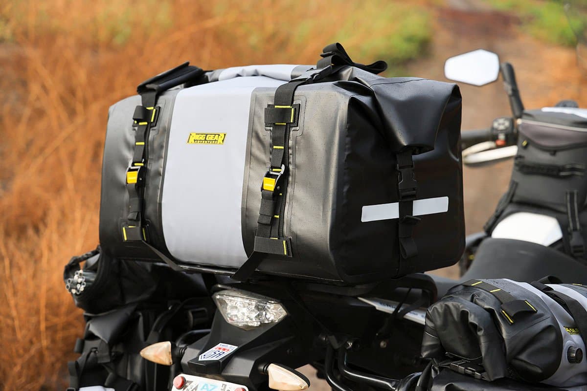 Hurricane duffle strapped across the pillion seat of an adventure bike