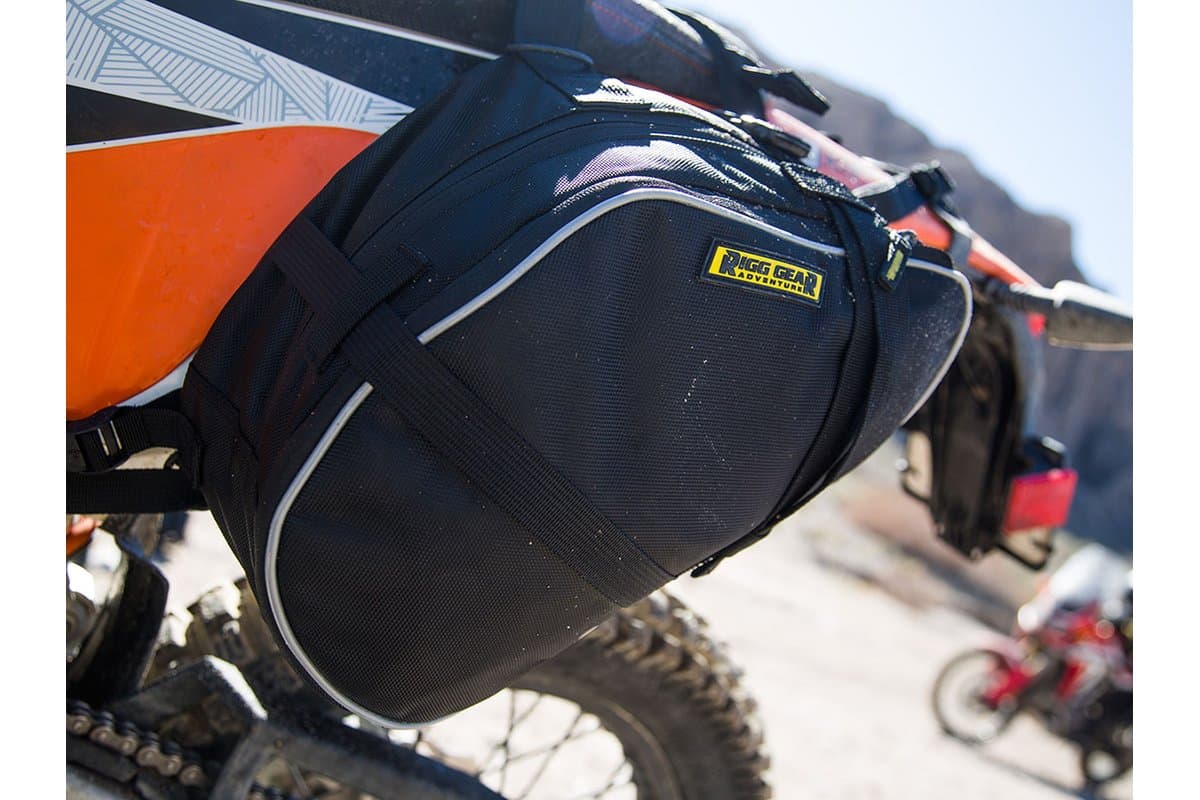 Trails End saddlebag hanging beside the rear wheel of a KTM