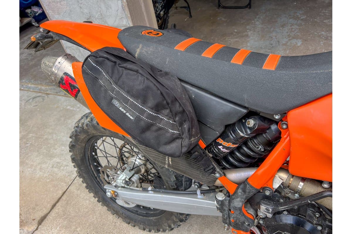 10L saddlebag mounted beside the seat of an orange KTM dirt bike