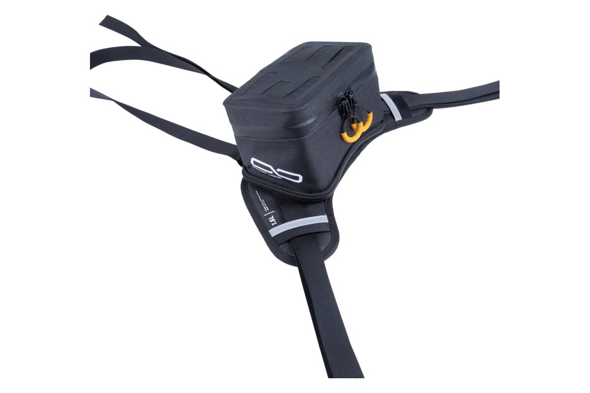 Giant Loop Buckin' Roll tank bag on its harness, three-quarter view