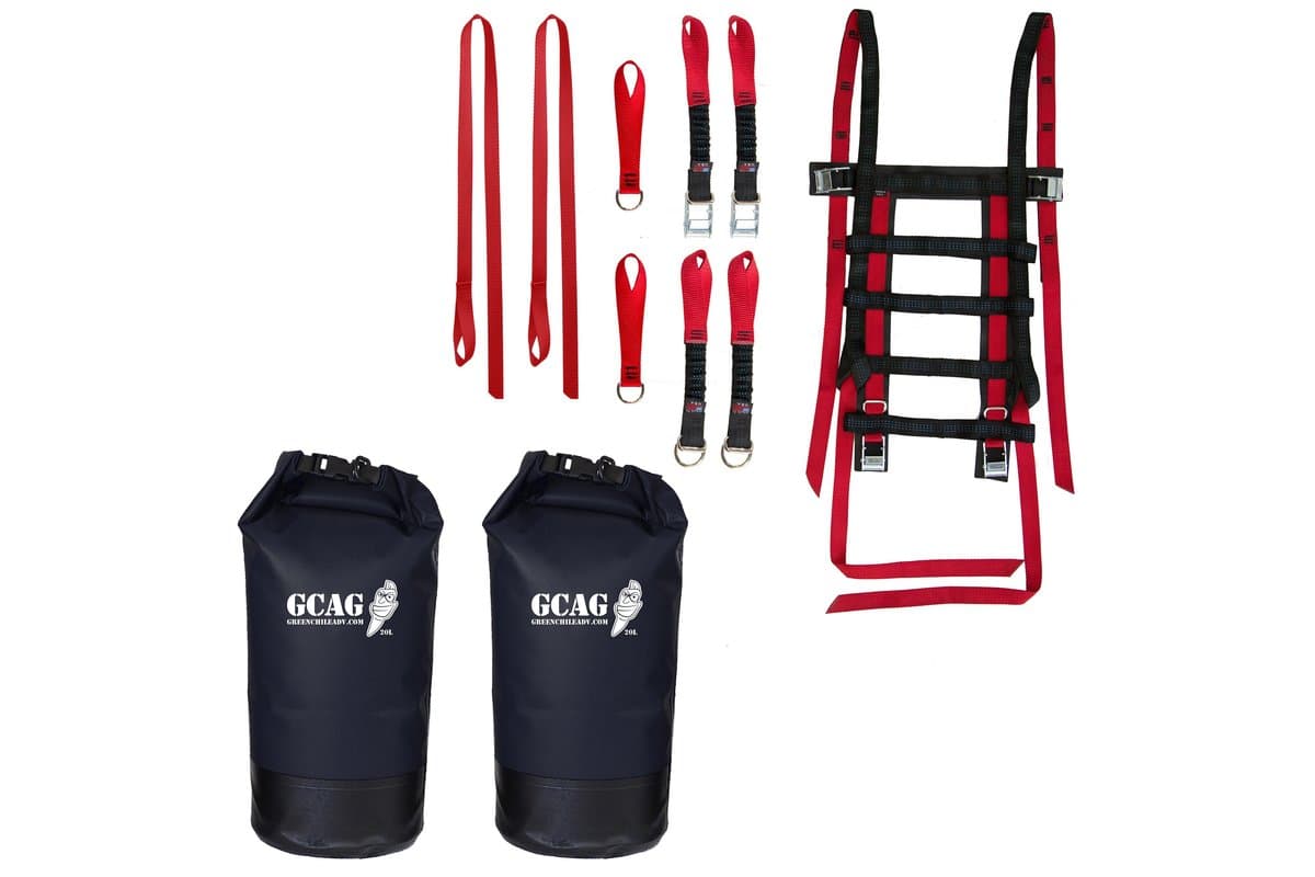 Pecos Value Bundle contents laid out on white: Uprising Soft Rack, red strap kits and two black 20 L dry bags