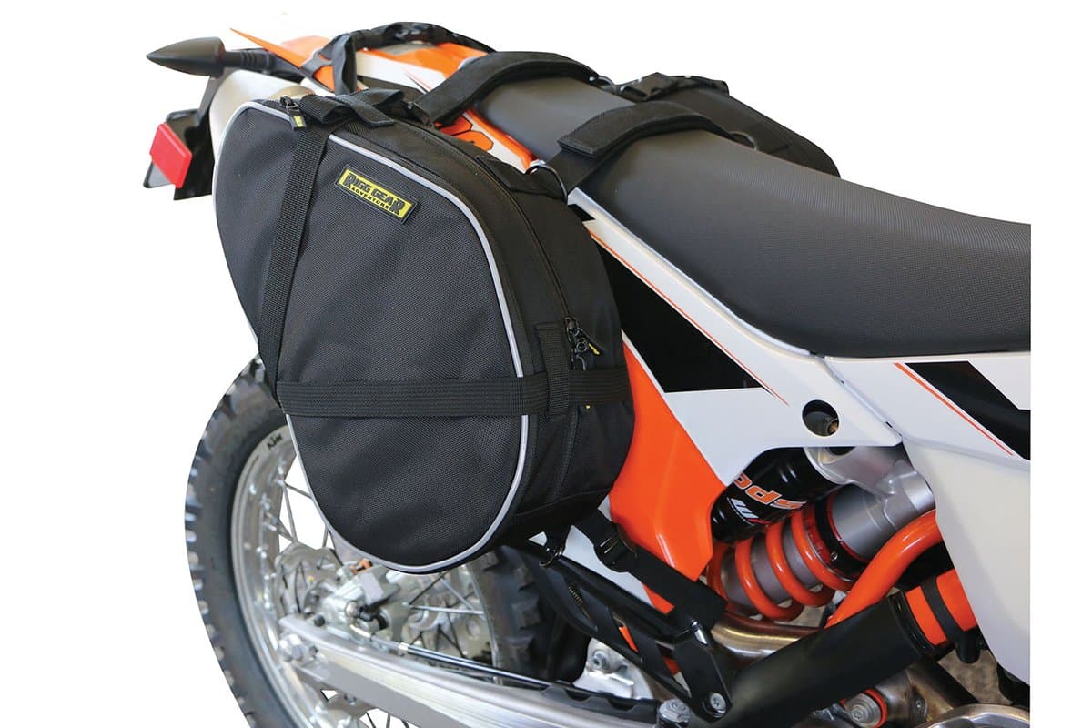 Trails End Dual Sport Saddlebags fitted to an orange dirt bike, cut out on white