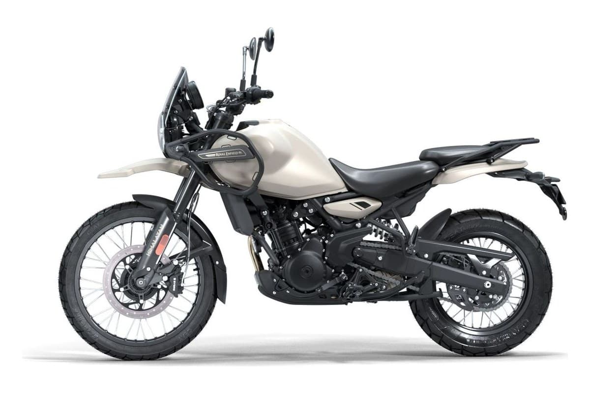 Royal Enfield Himalayan 450 adventure motorcycle in sand beige, left-side studio profile showing spoked wheels and tall windscreen