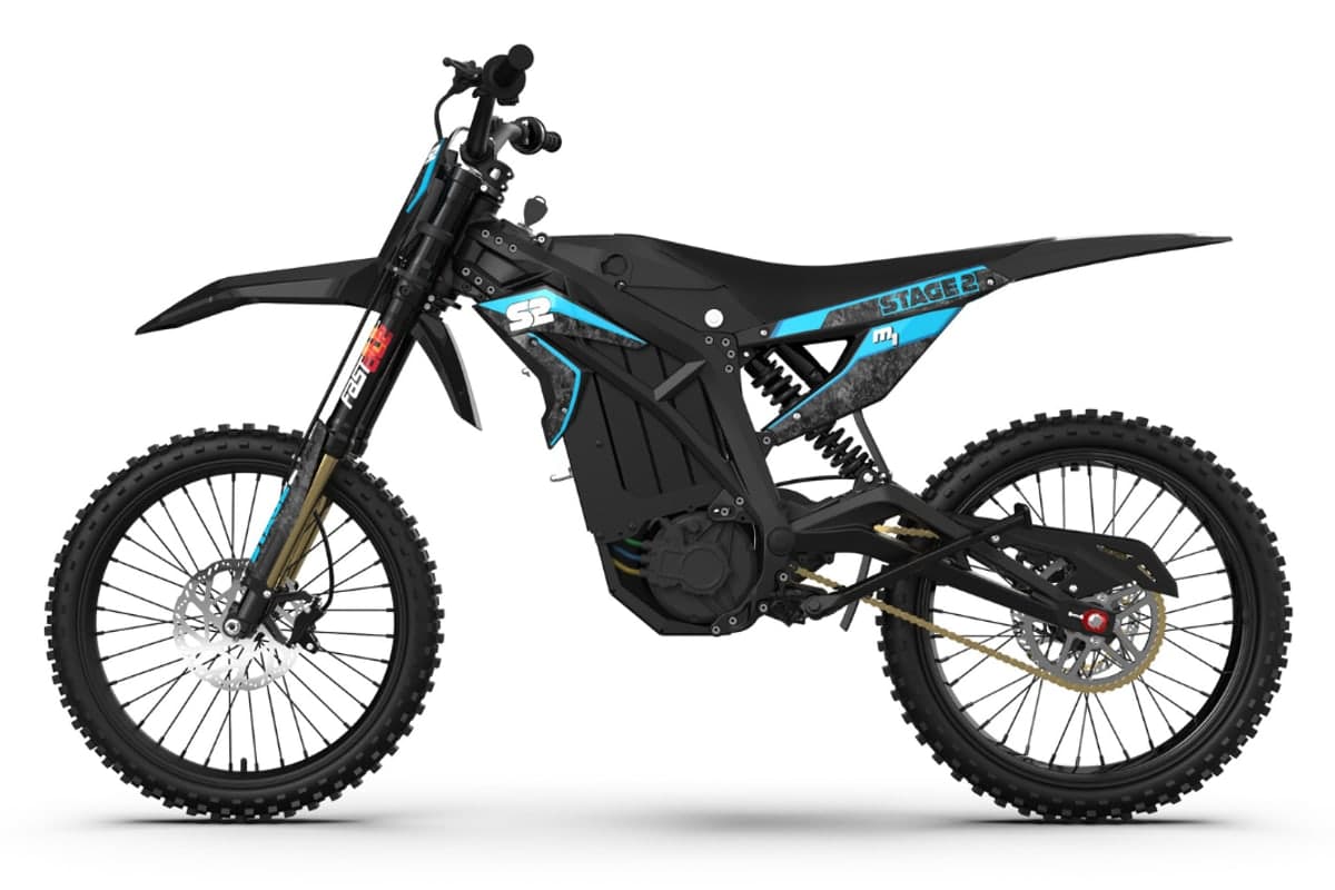 2026 Stage2 M1 electric dirt bike in black with cyan graphics, left-side studio profile on a white background