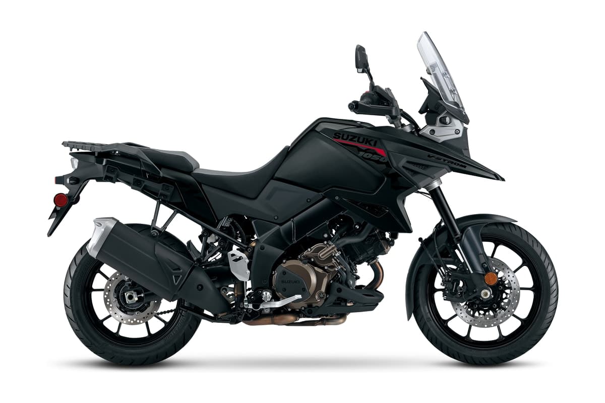 2027 Suzuki V-Strom 1050 adventure motorcycle in Metallic Matte Black No. 2 with red Suzuki logos, right-side studio profile showing the cast wheels, tall windscreen and V-twin engine
