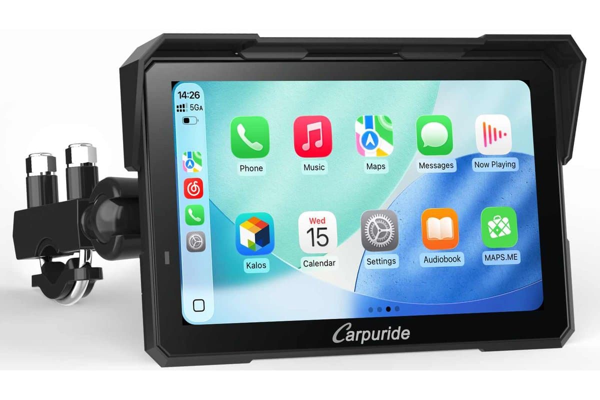 Carpuride W702 Plus 7-inch display with sun visor on its U-bolt handlebar mount, showing the CarPlay home screen