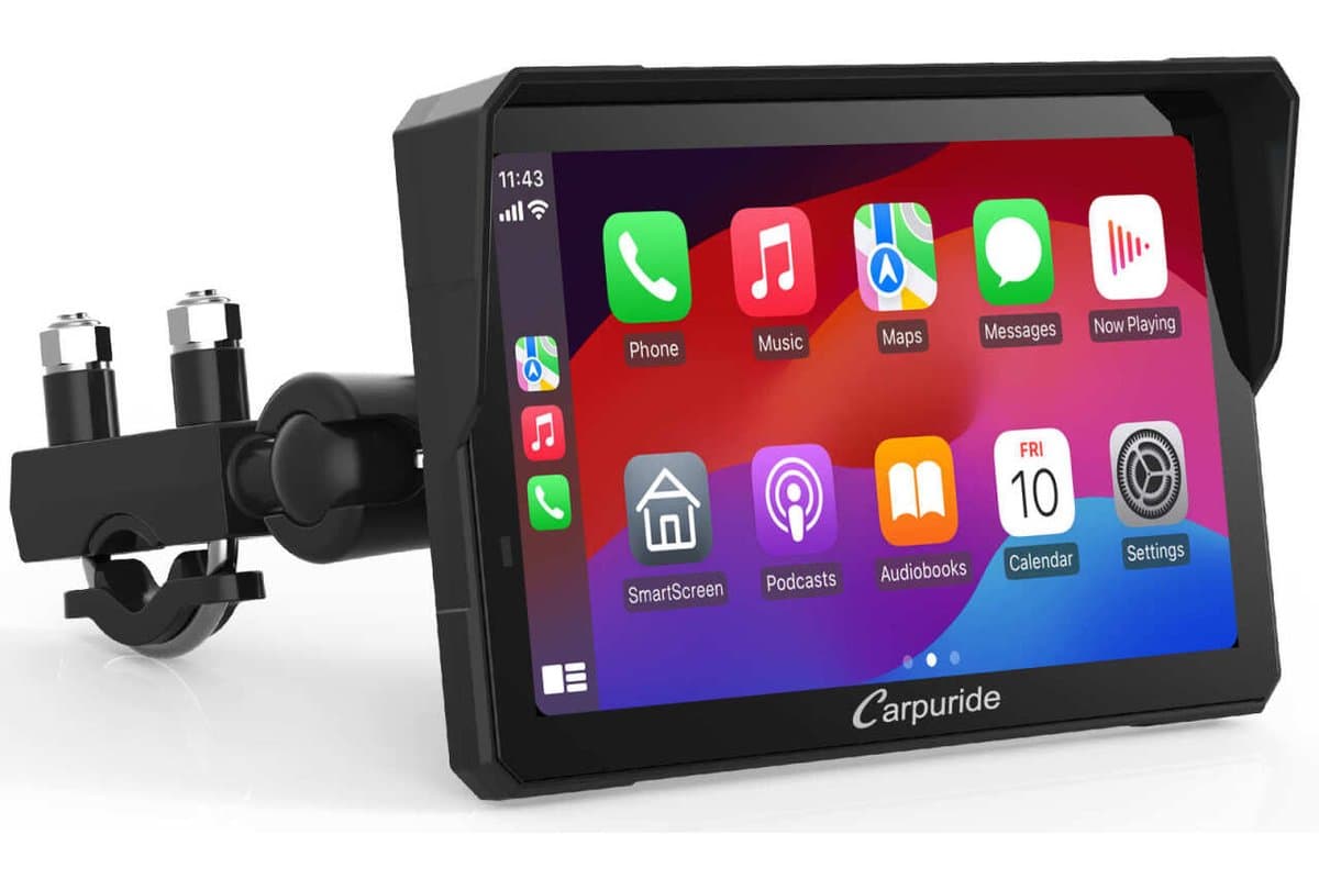 Carpuride W702 Pro 7-inch display with sun visor on its U-bolt handlebar mount, showing the CarPlay home screen