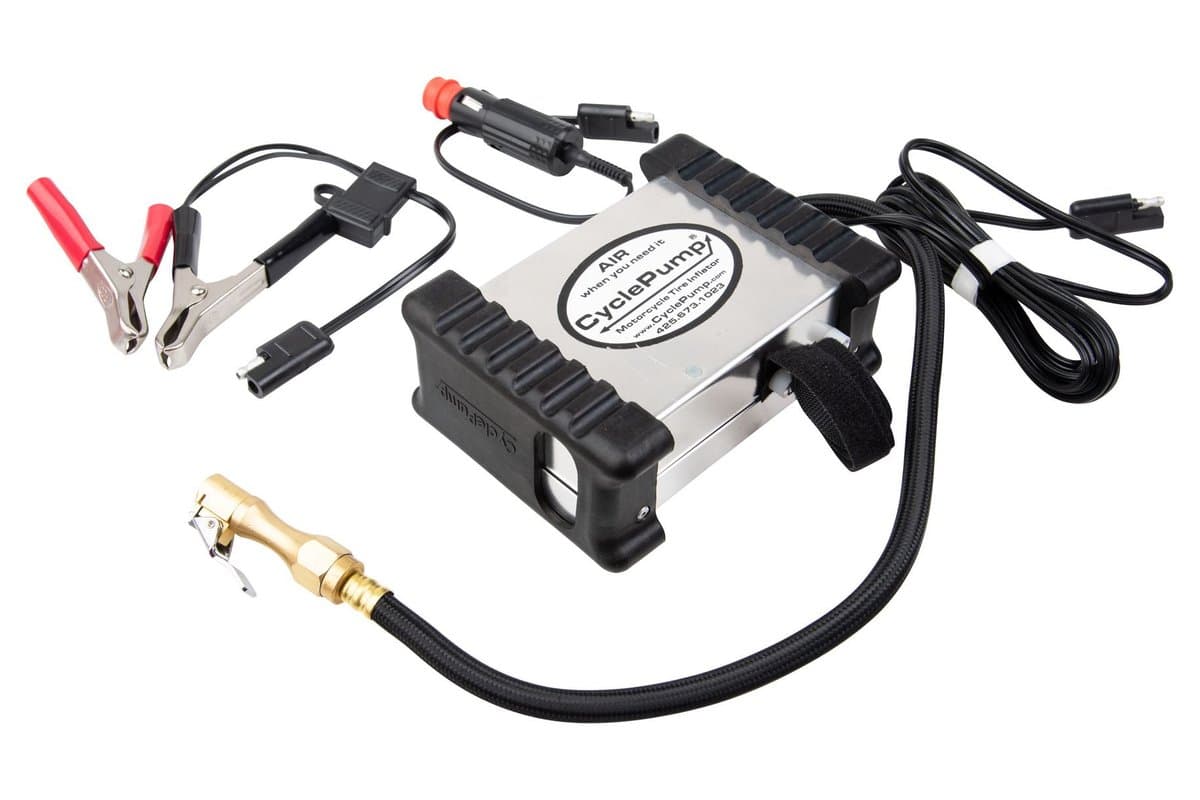 CyclePump Expedition inflator in its rubber-capped aluminium case, with the braided hose and brass chuck, the alligator-clip, SAE, BMW-style and cigarette power leads