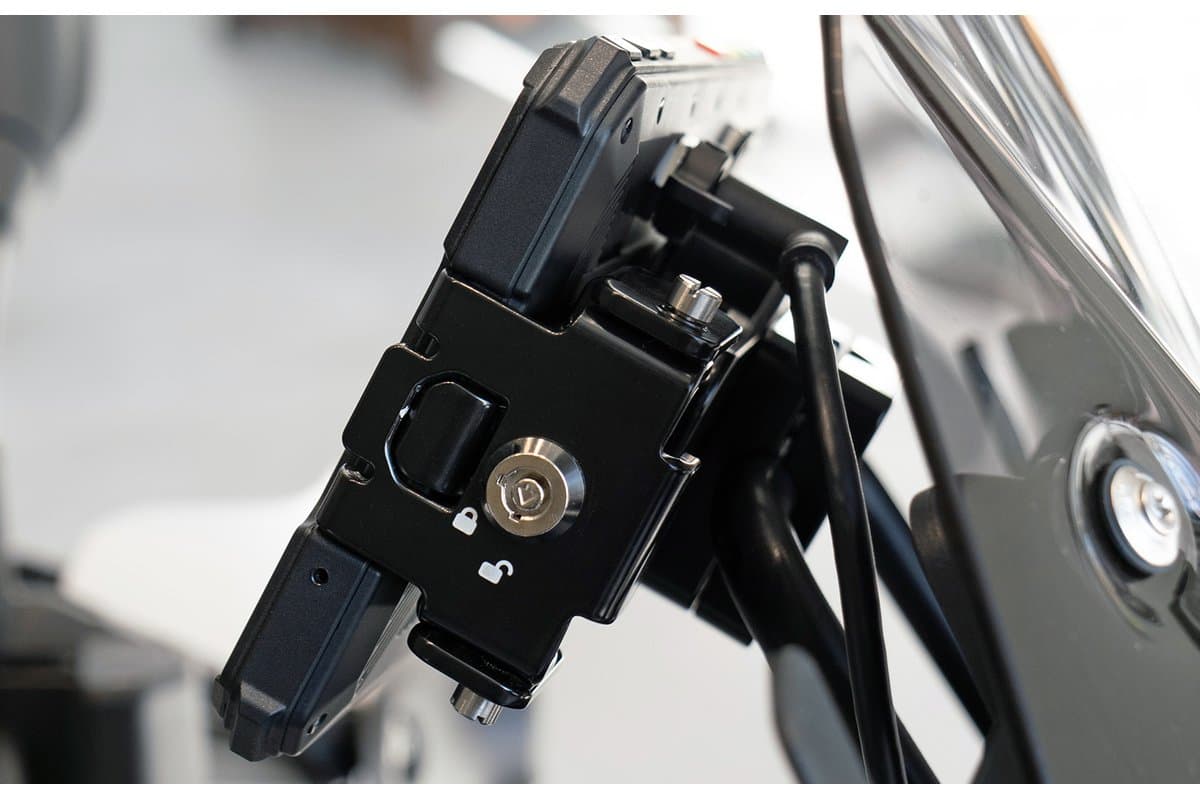 DMD NOR7E metal holder with its key lock, mounted on a motorcycle