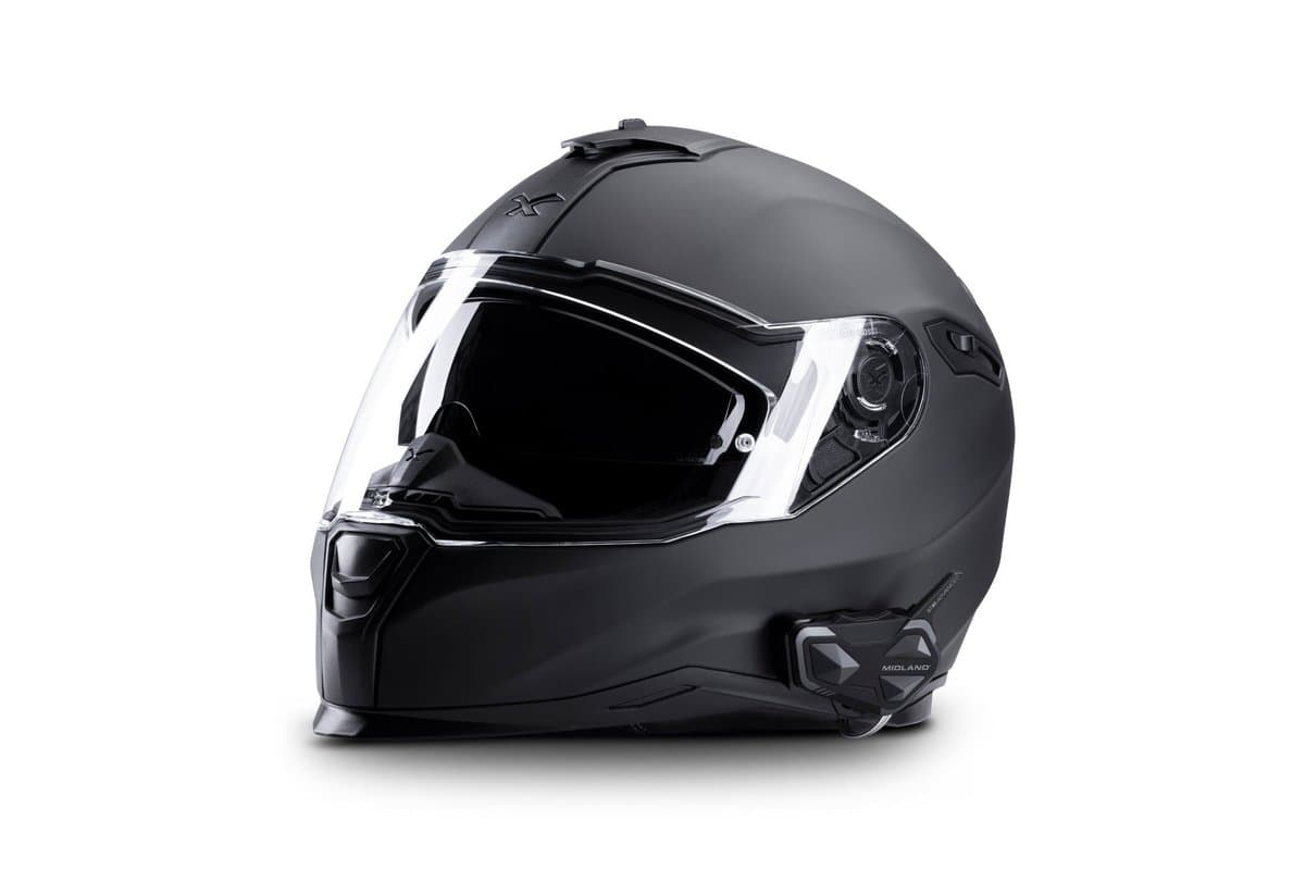 Midland BTR1 Advanced mounted on the left side of a matte black full-face helmet