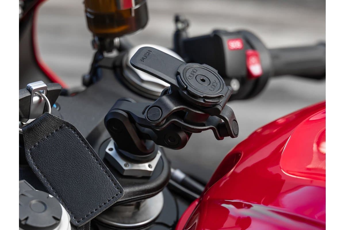Fork Stem Mount PRO installed in the steering stem of a motorcycle with the optional Vibration Dampener