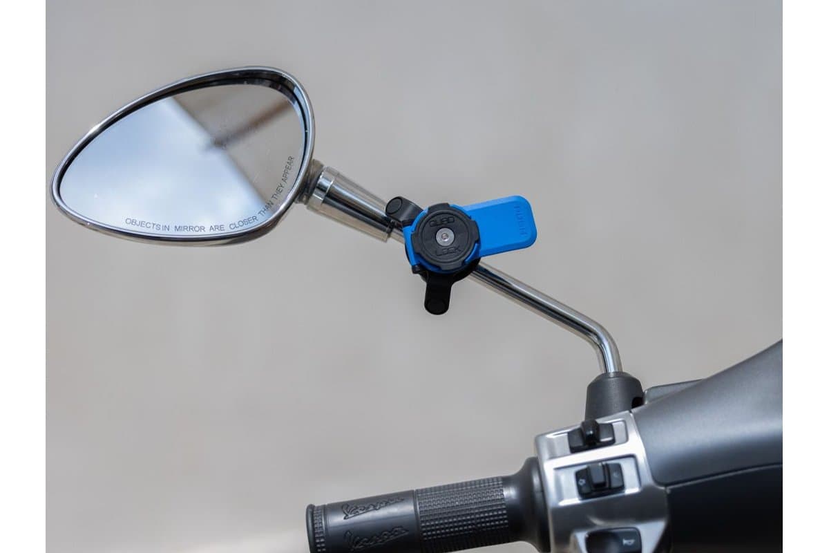 Quad Lock Mirror Mount clamped to a scooter mirror stem