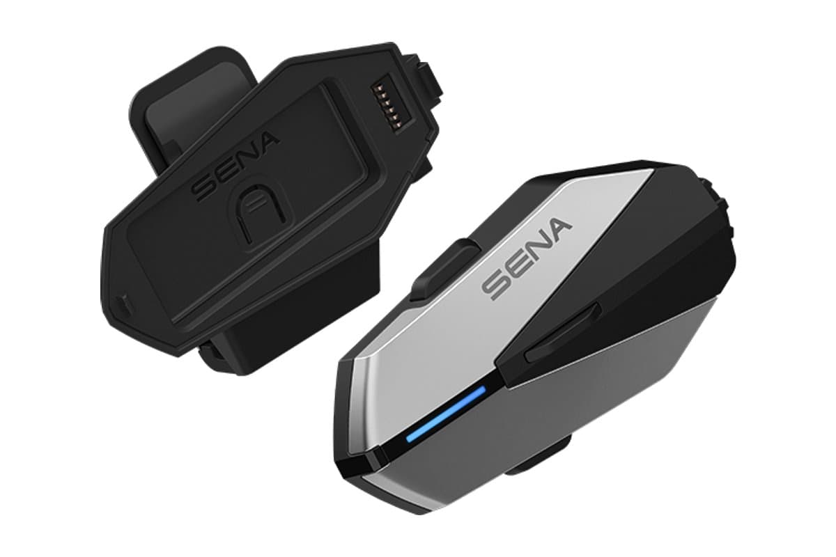Sena APEX Plus main unit beside its helmet mount cradle