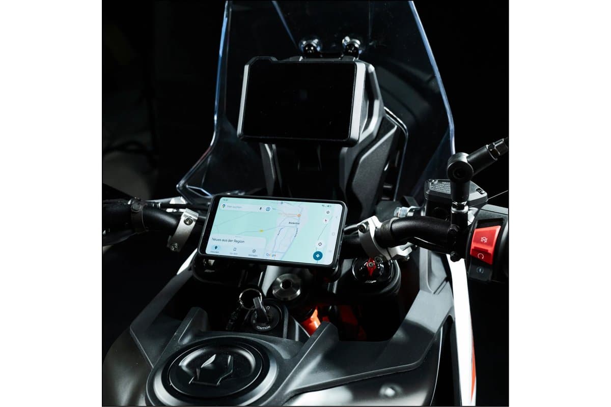 Phone showing a map on a Moto Mount Pro at the centre of an adventure bike's handlebar