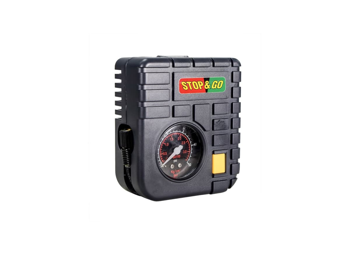 The kit's mini air compressor with its analog pressure gauge
