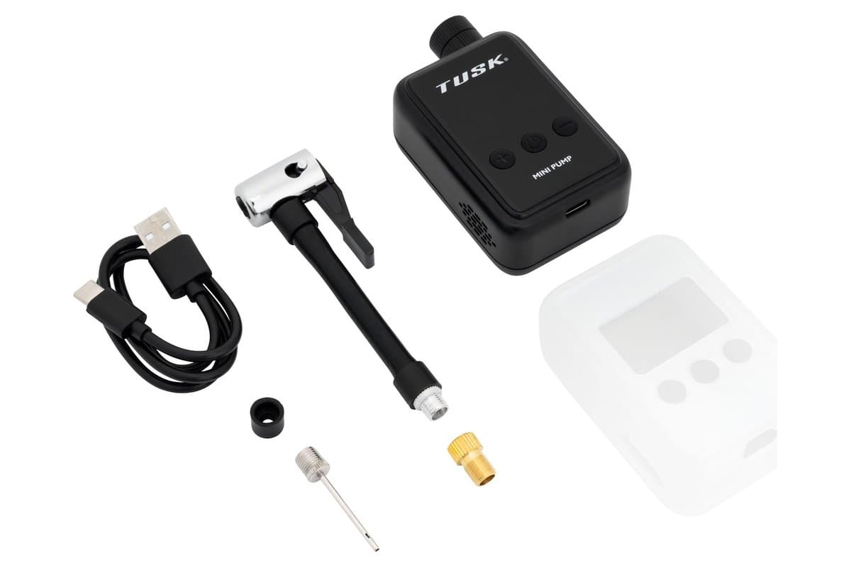 The inflator with its charging cable, hose, valve adapters and clear protective sleeve
