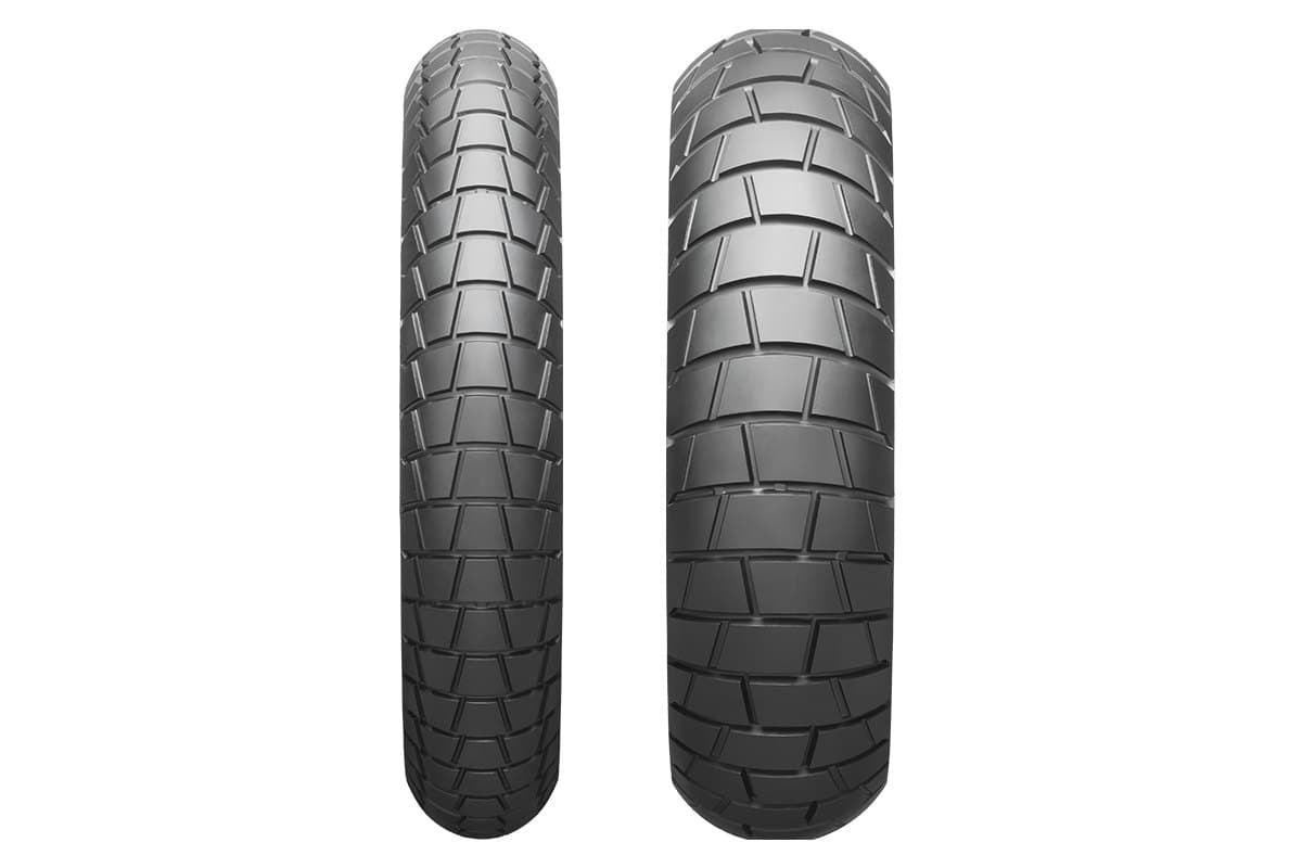 Bridgestone Battlax Adventure Trail AT41: front and rear tire side by side, straight-on tread view showing the blocky pattern, on white