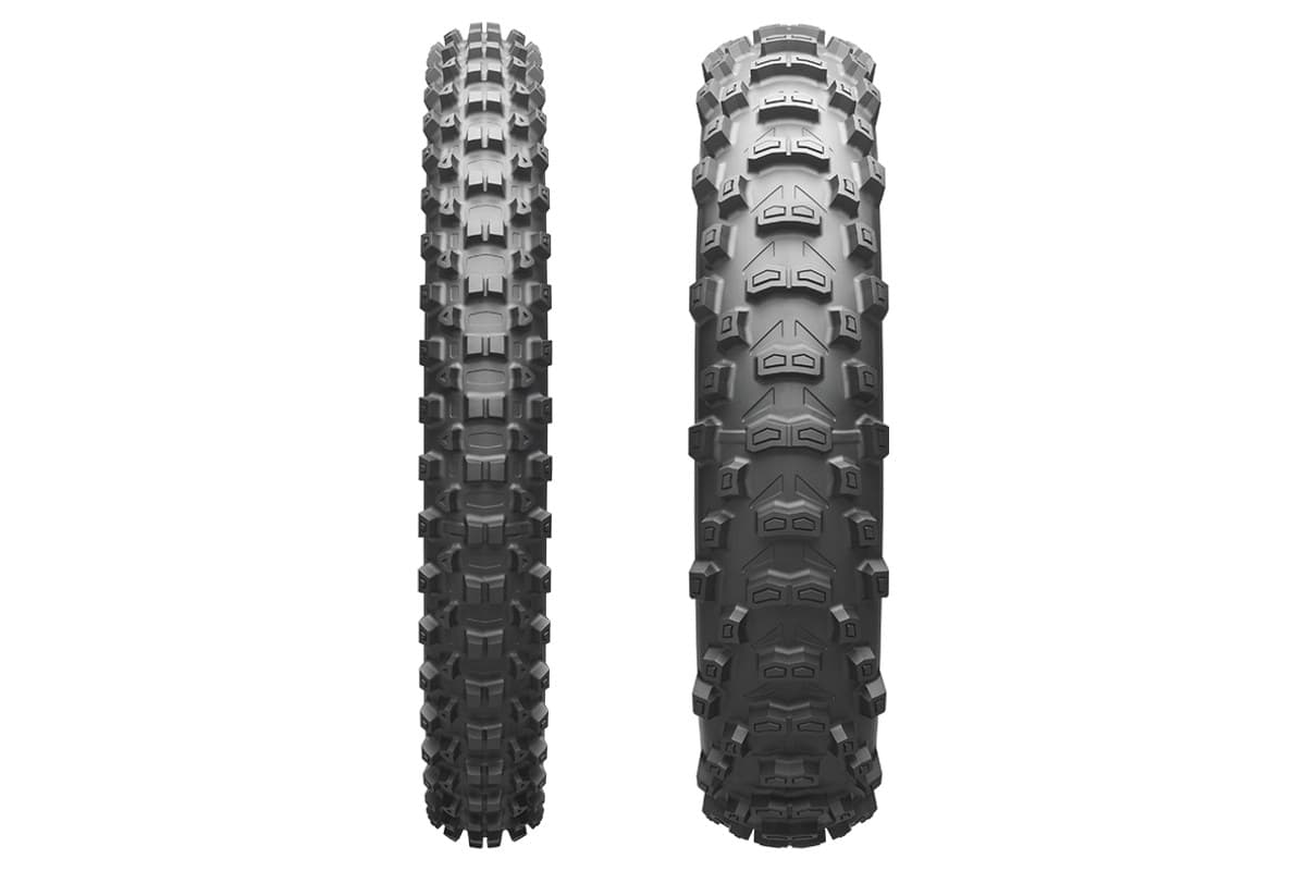 Bridgestone Battlecross E50 front and rear side by side, straight-on view of the knobby tread, on white