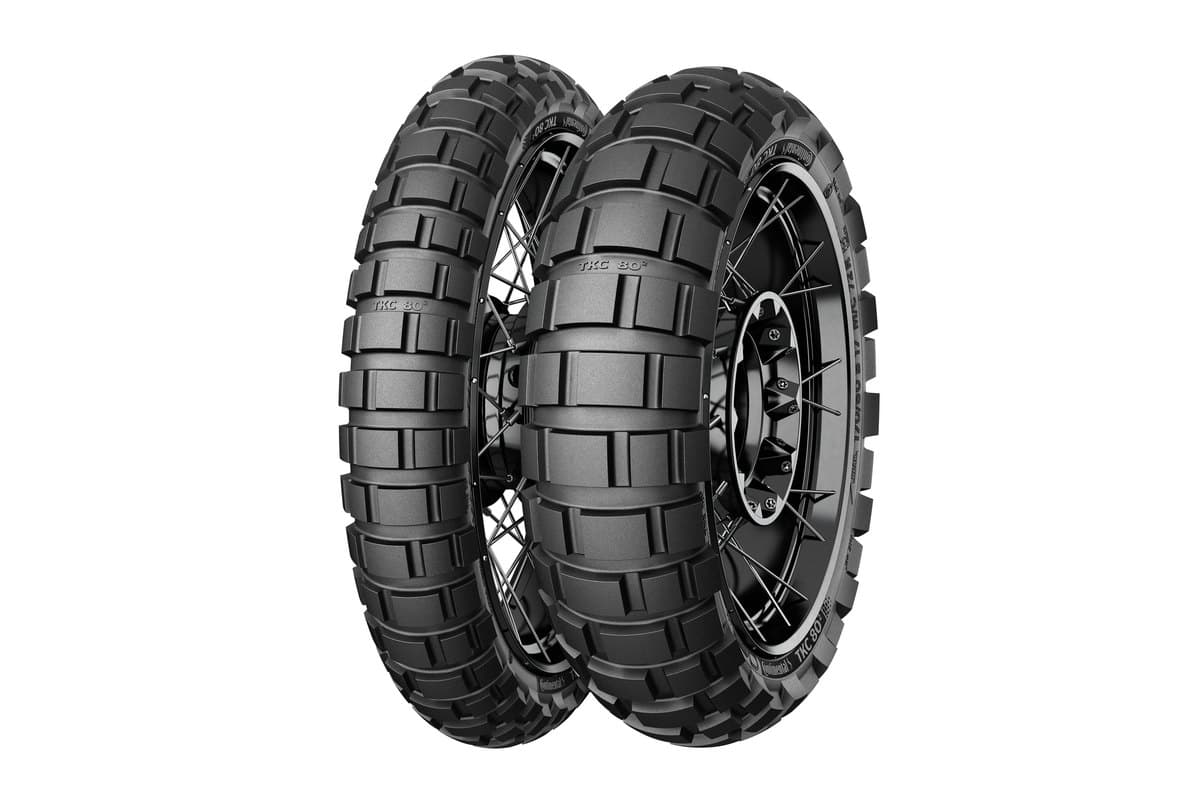 Continental TKC 80 Second Generation: front and rear tire in a three-quarter view on black spoked wheels, with the second-generation name moulded into the tread