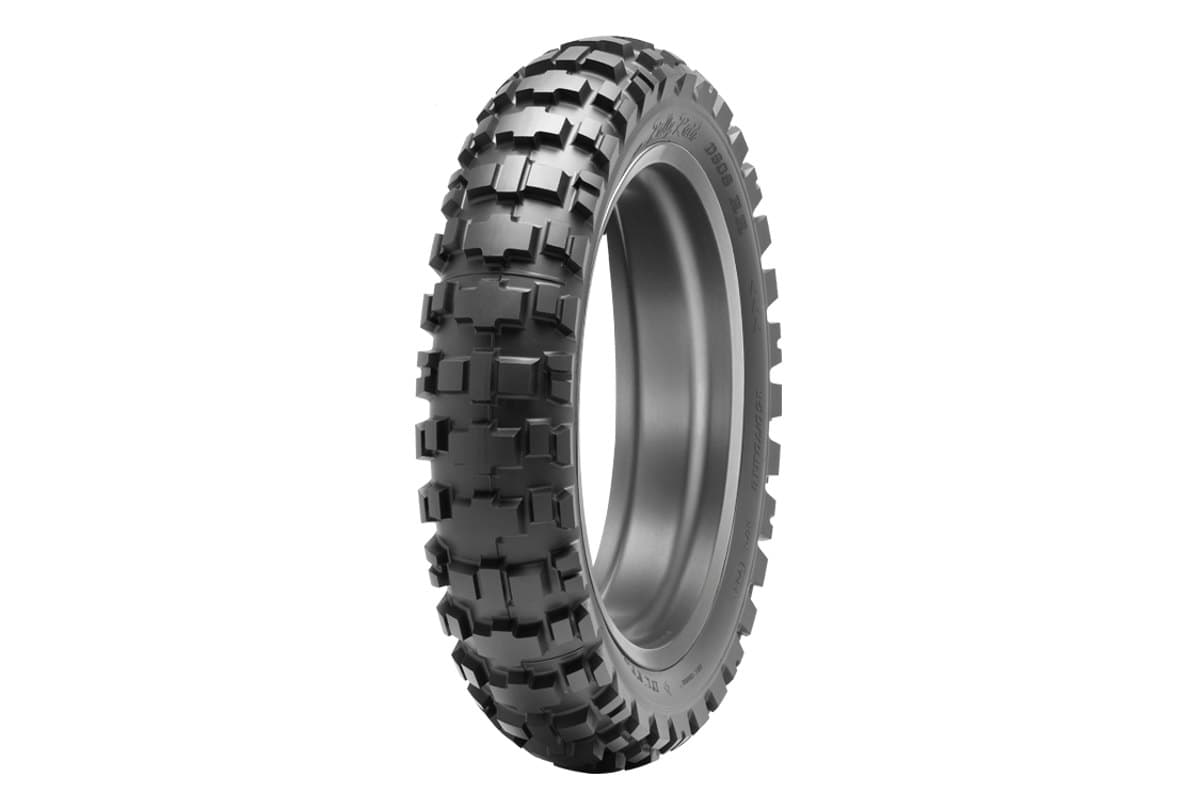Dunlop D908RR Rally Raid: the rear tire on a bare silver rim, three-quarter view on white. A single shot is correct here, this model is rear only