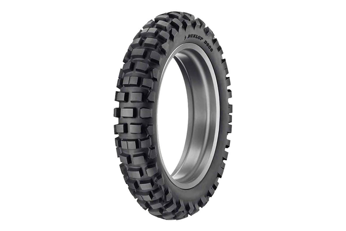 Dunlop D606: rear tire on a bare silver rim, three-quarter view, with the model moulded into the sidewall